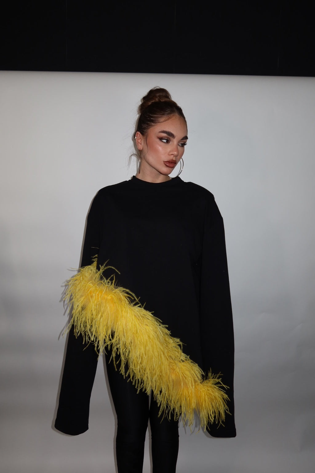 Maglia piuma asimmetrica