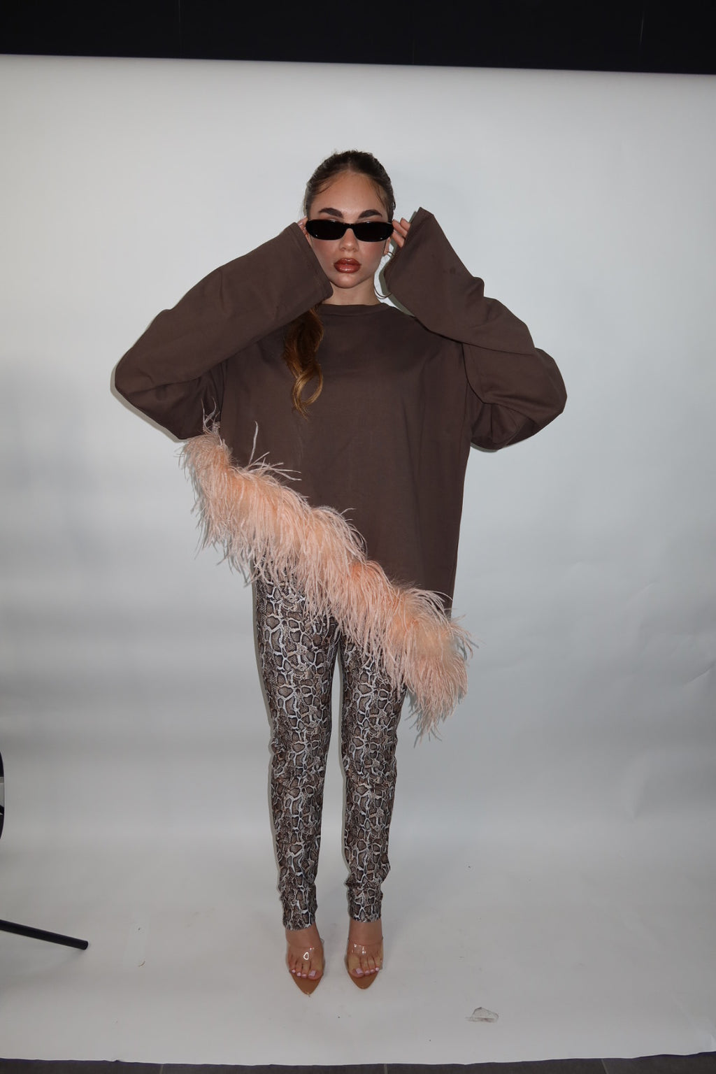 Maglia piuma asimmetrica